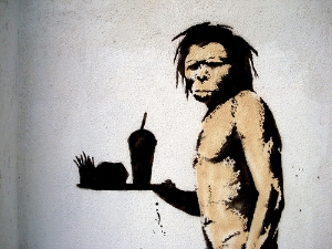 Banksy caveman with chips and burgers on a tray - video content marketing examples